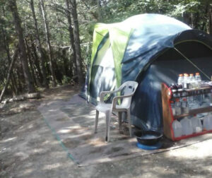 homeless person living in a tent