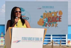 Sylisa addressing the crowd from the podium
